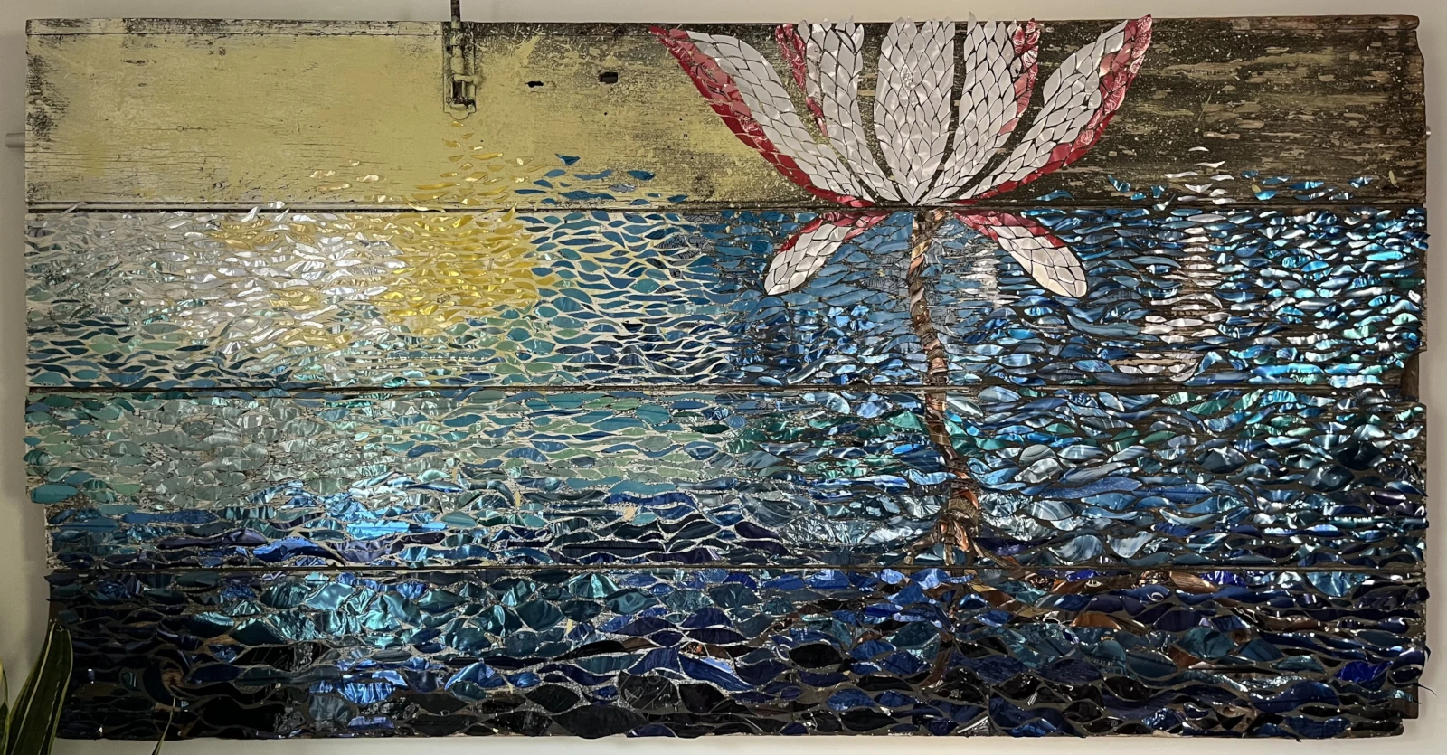 A lotus flower artwork hanging in Jen's office